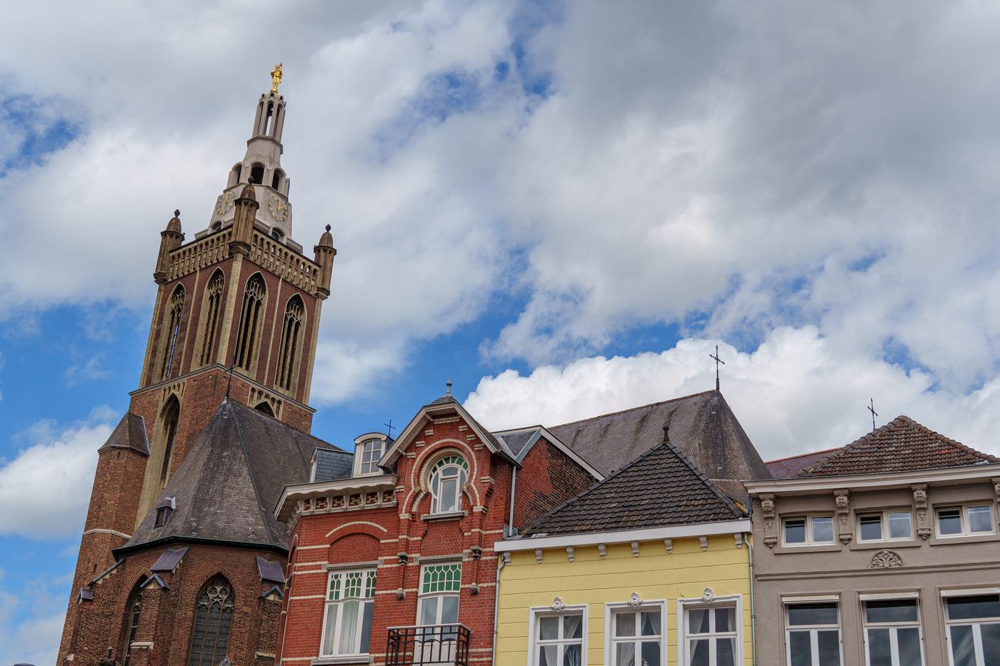 A church tower above historic facades