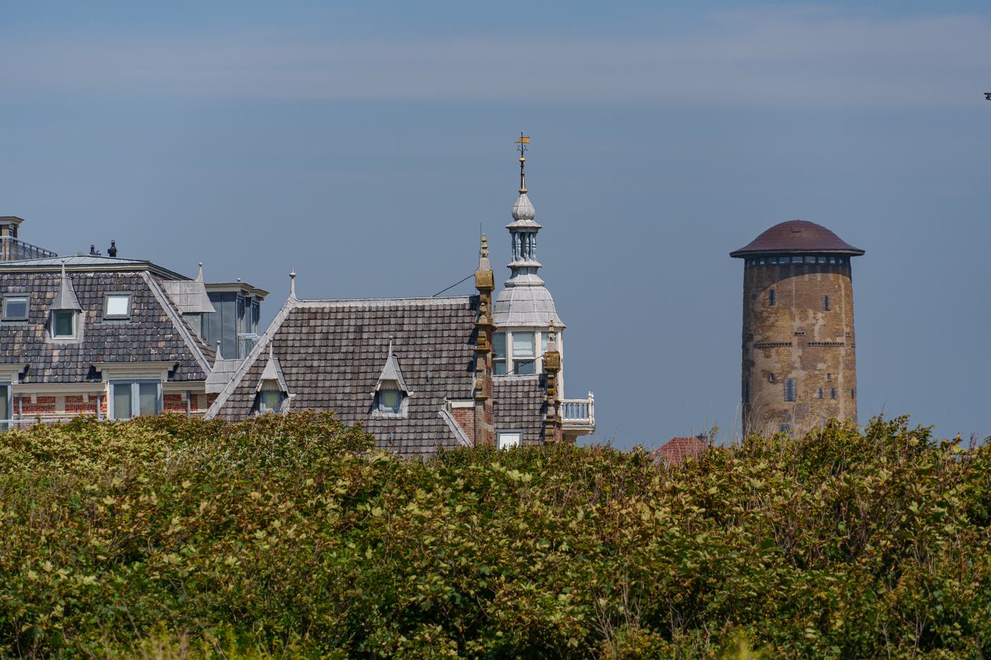 A water tower and rooftops on the Zeeland coast