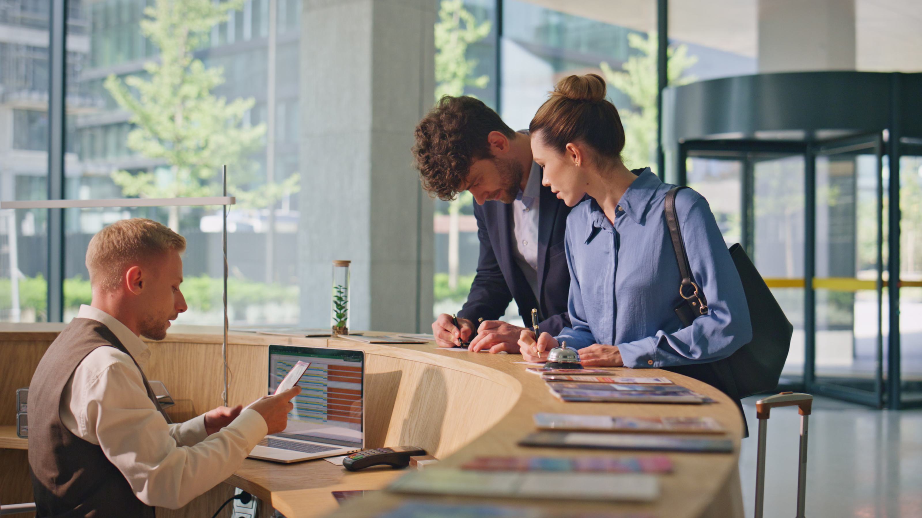 Staff helping visitors at a public service desk